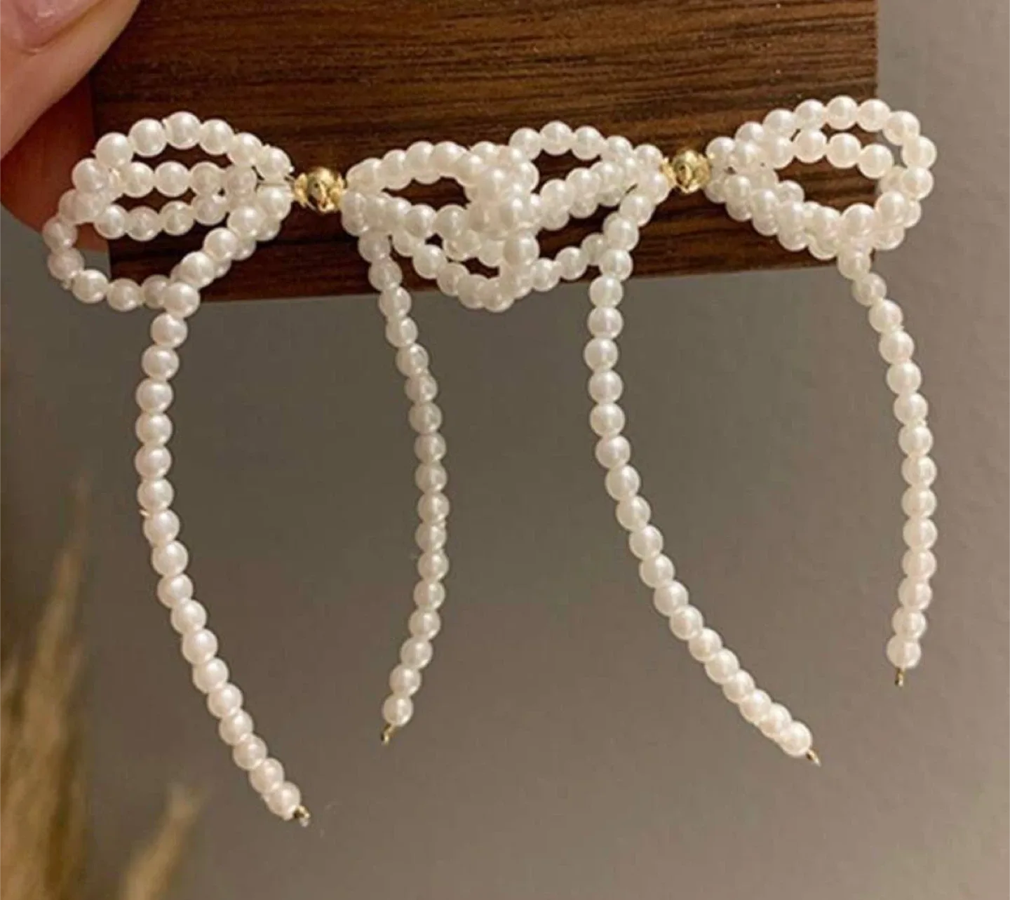 Bow & faux pearl earrings image indicator(3)