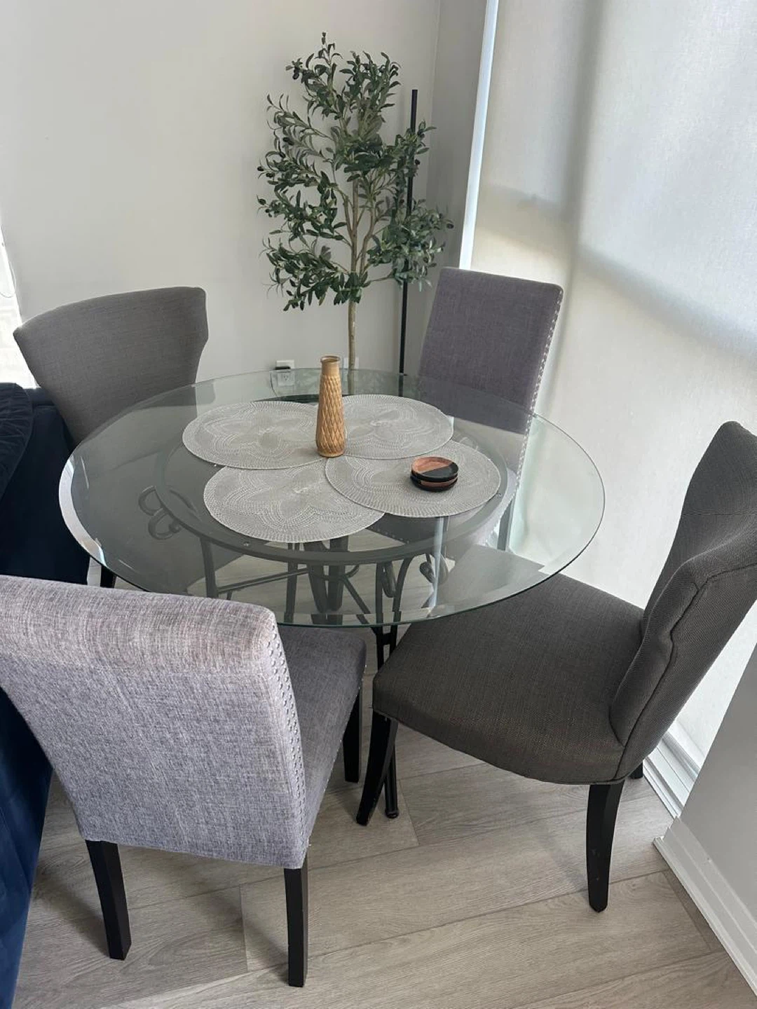 Glass Round Dining Table with Four Grey Chairs