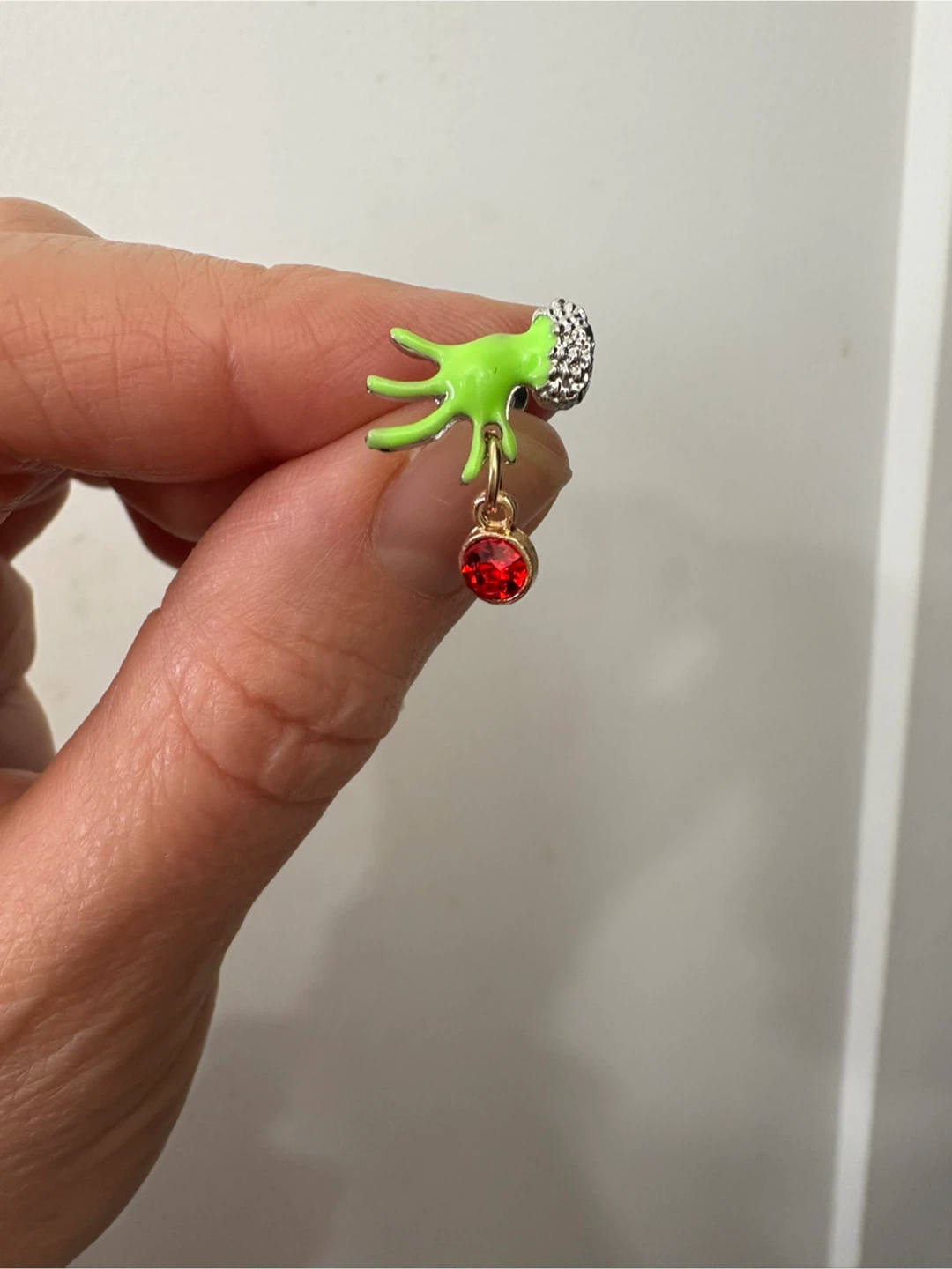 One Grinch earring
