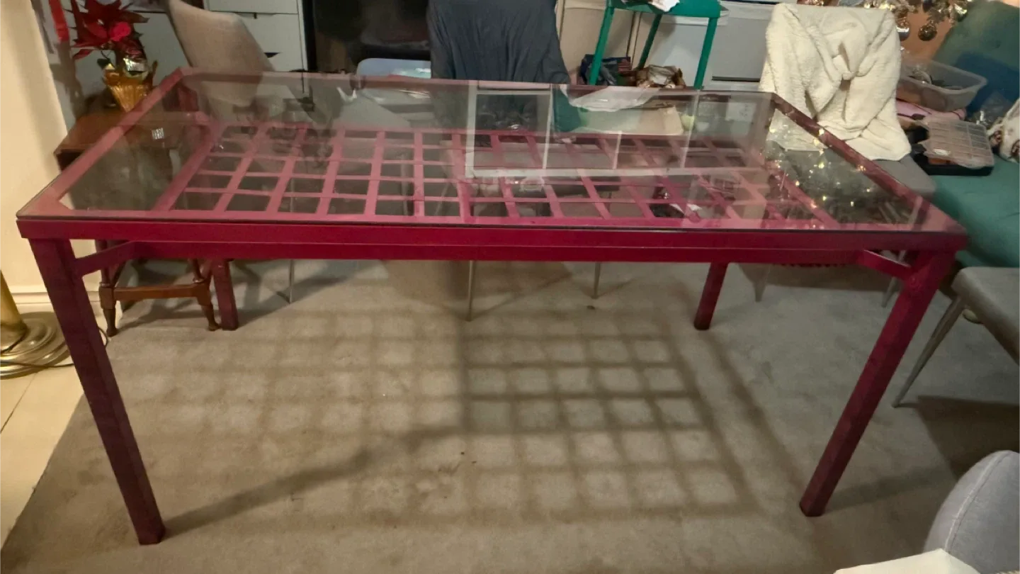 Glass top dining table with pink frame