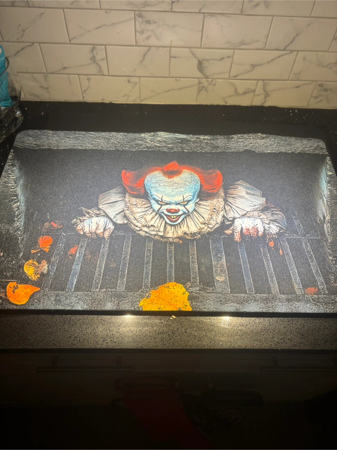 Pennywise the clown in sewer floor mat