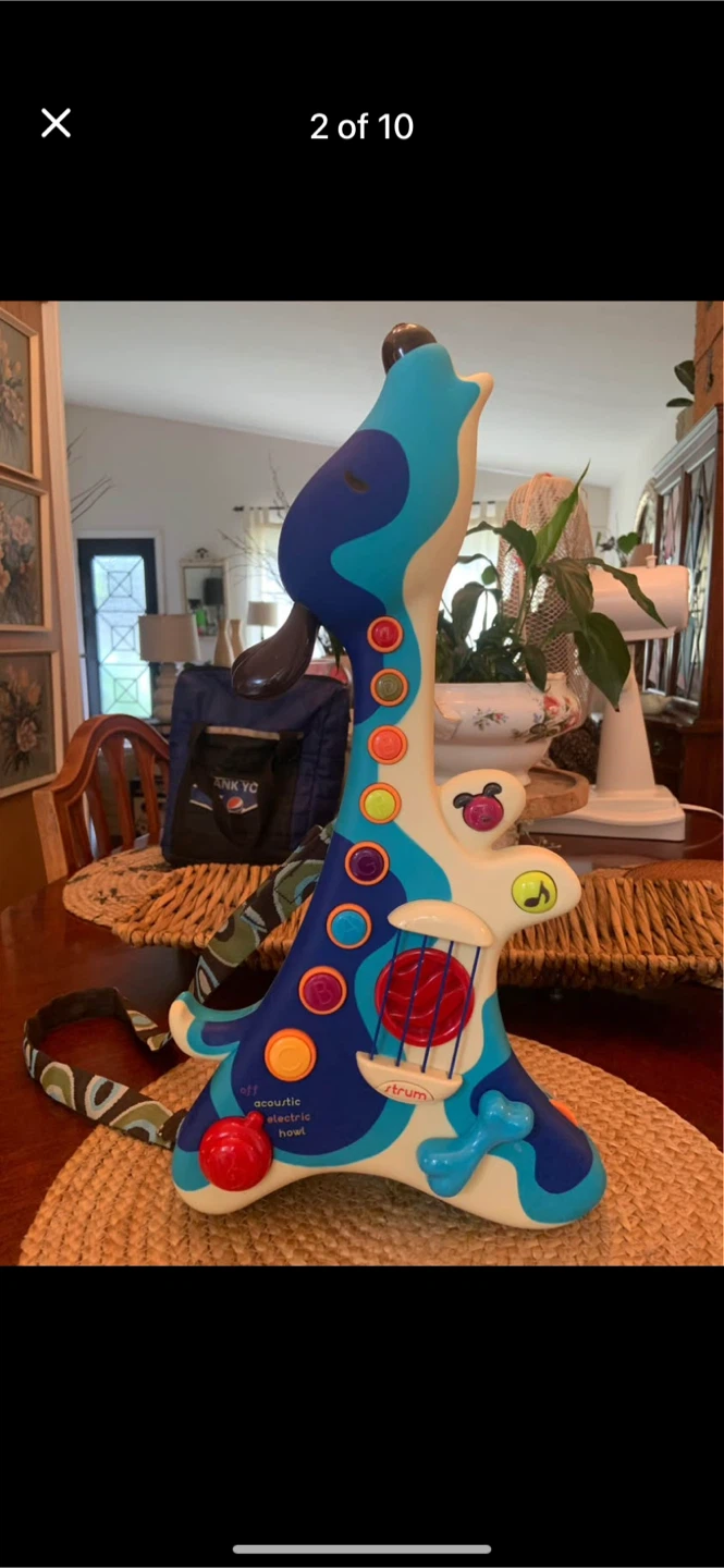 B. WOOFER HOUND DOG TODDLER MUSICAL GUITAR