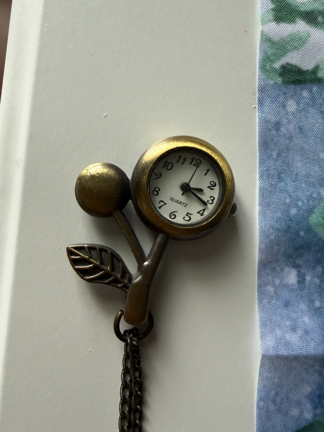 Long chain clock necklace