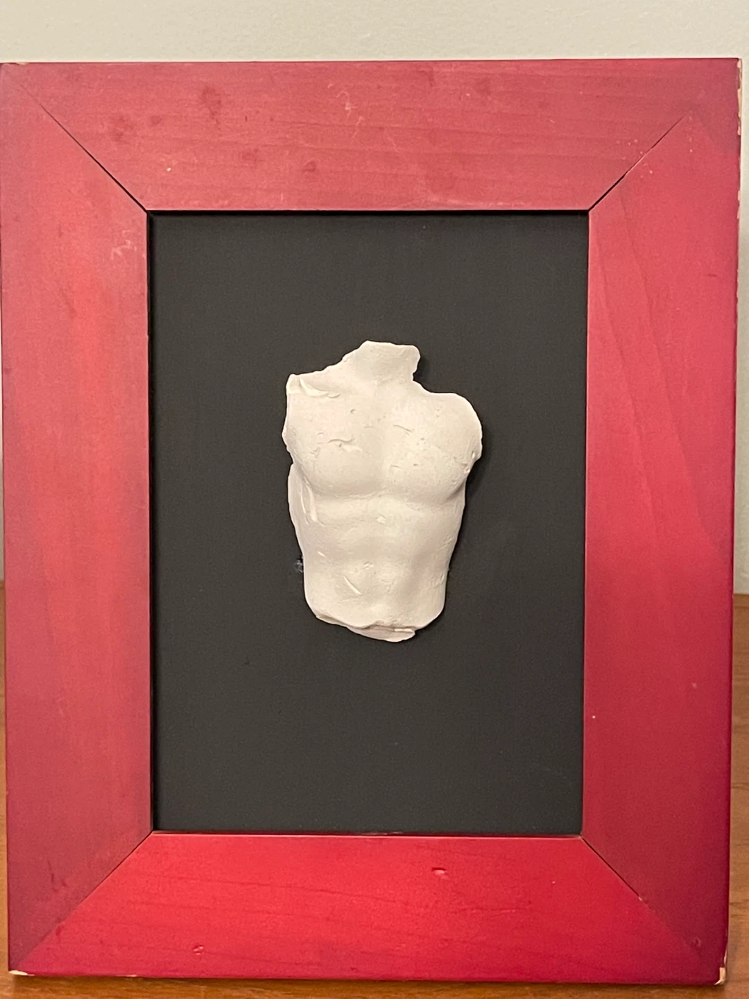 Framed miniature plaster bust fragment