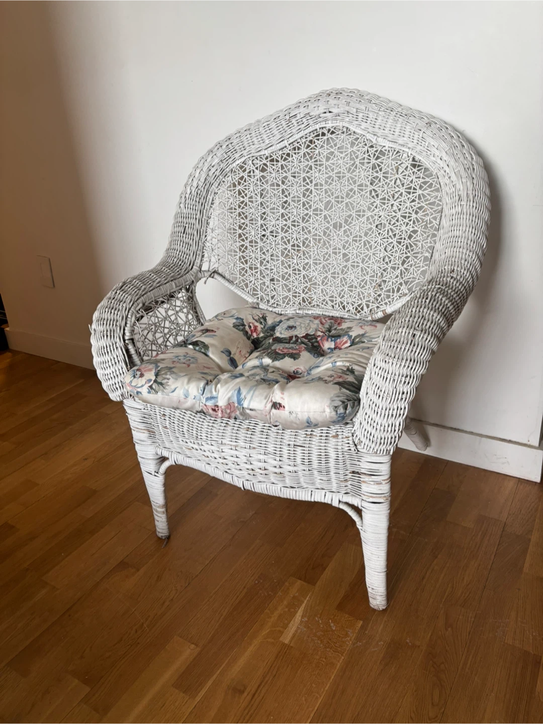 White Wicker Chair with Floral Cushion