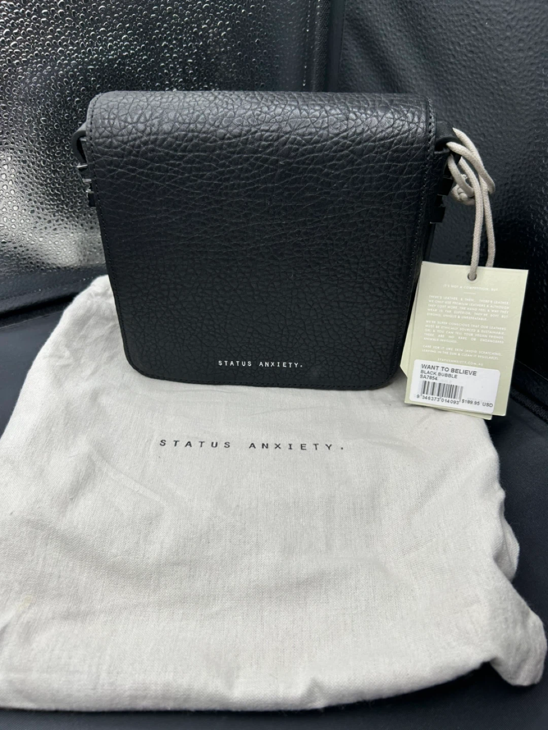 Status Anxiety Want to Believe Black Bag