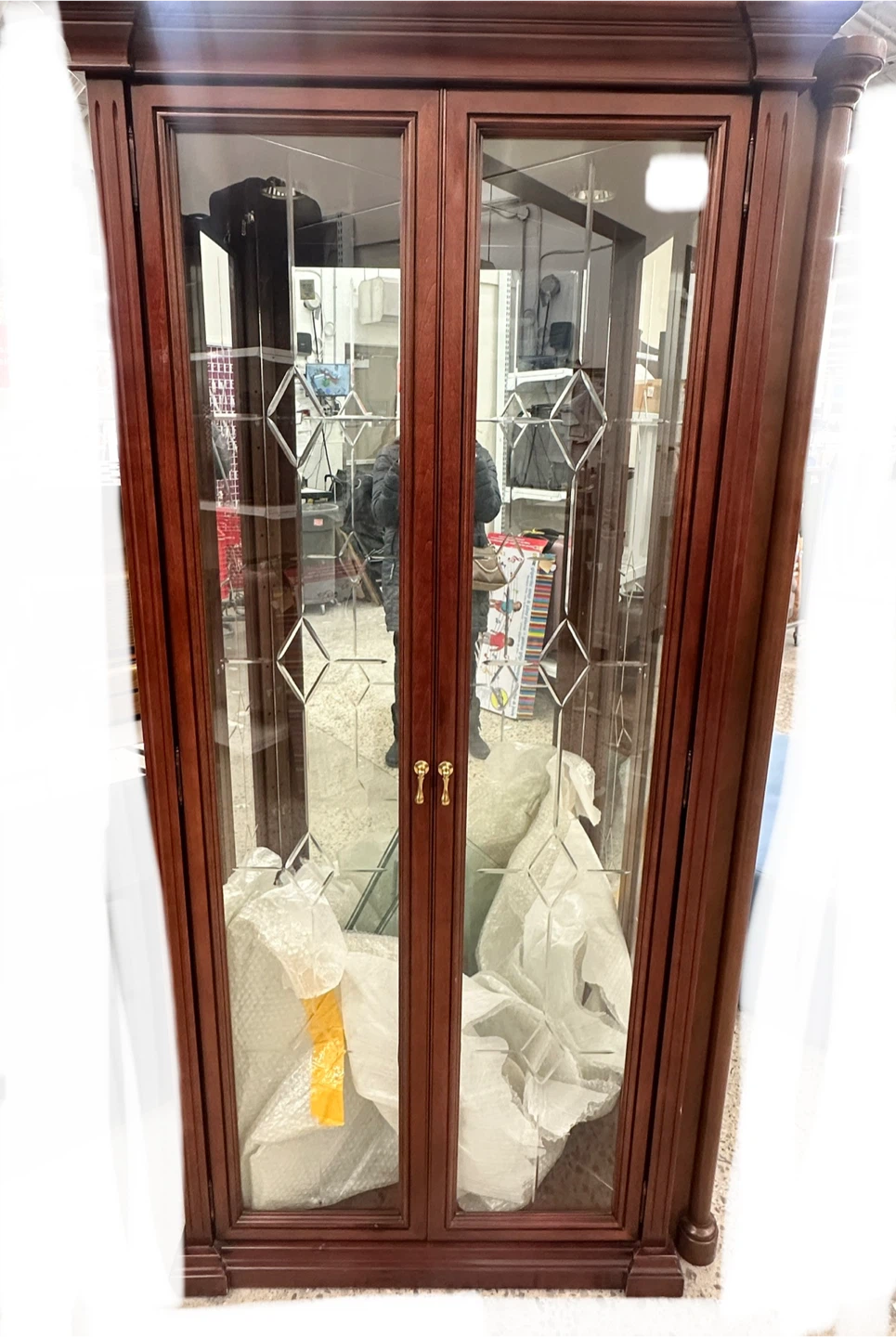 Corner curio/display cabinet with glass doors and shelves