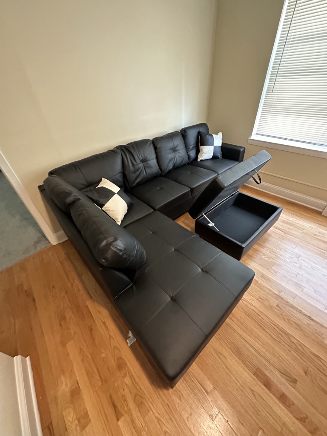 Black Leather Sectional Sofa with Storage ottoman