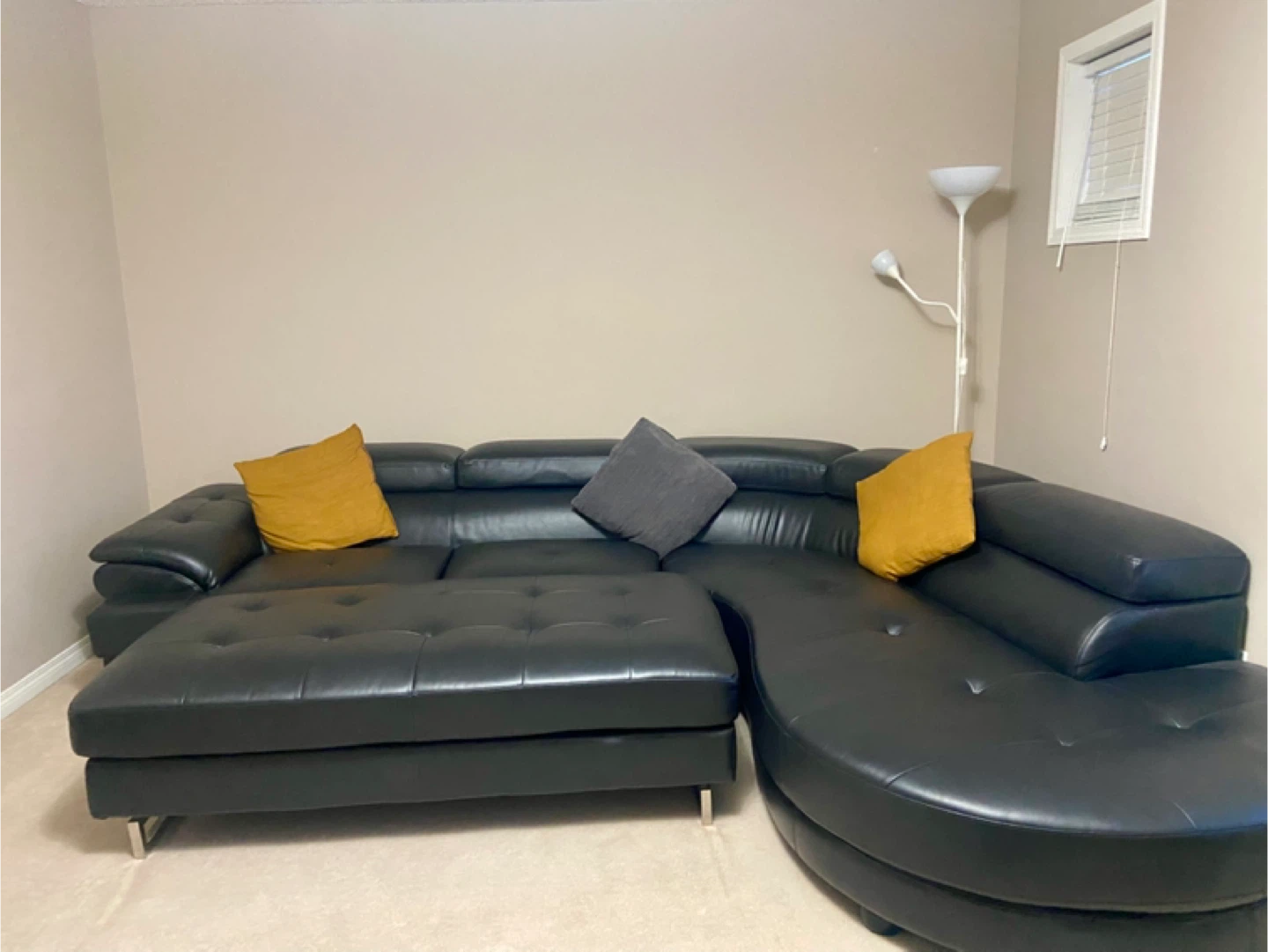 Modern black leather sectional sofa with chaise