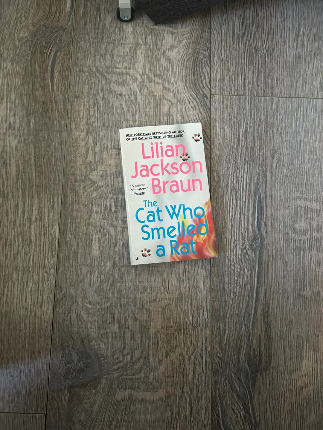 "The Cat Who Smelled a Rat" by Lilian Jackson Braun