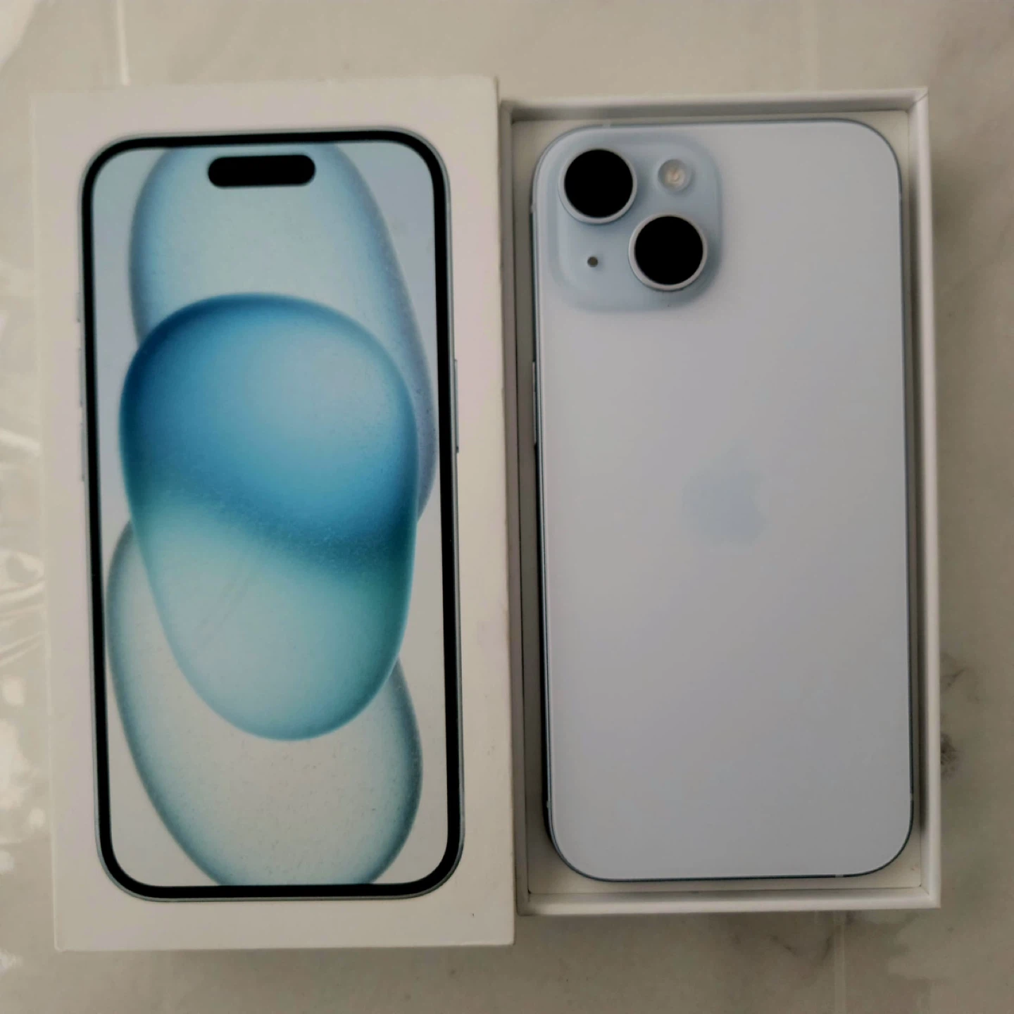 New iPhone 15- Blue, with Case