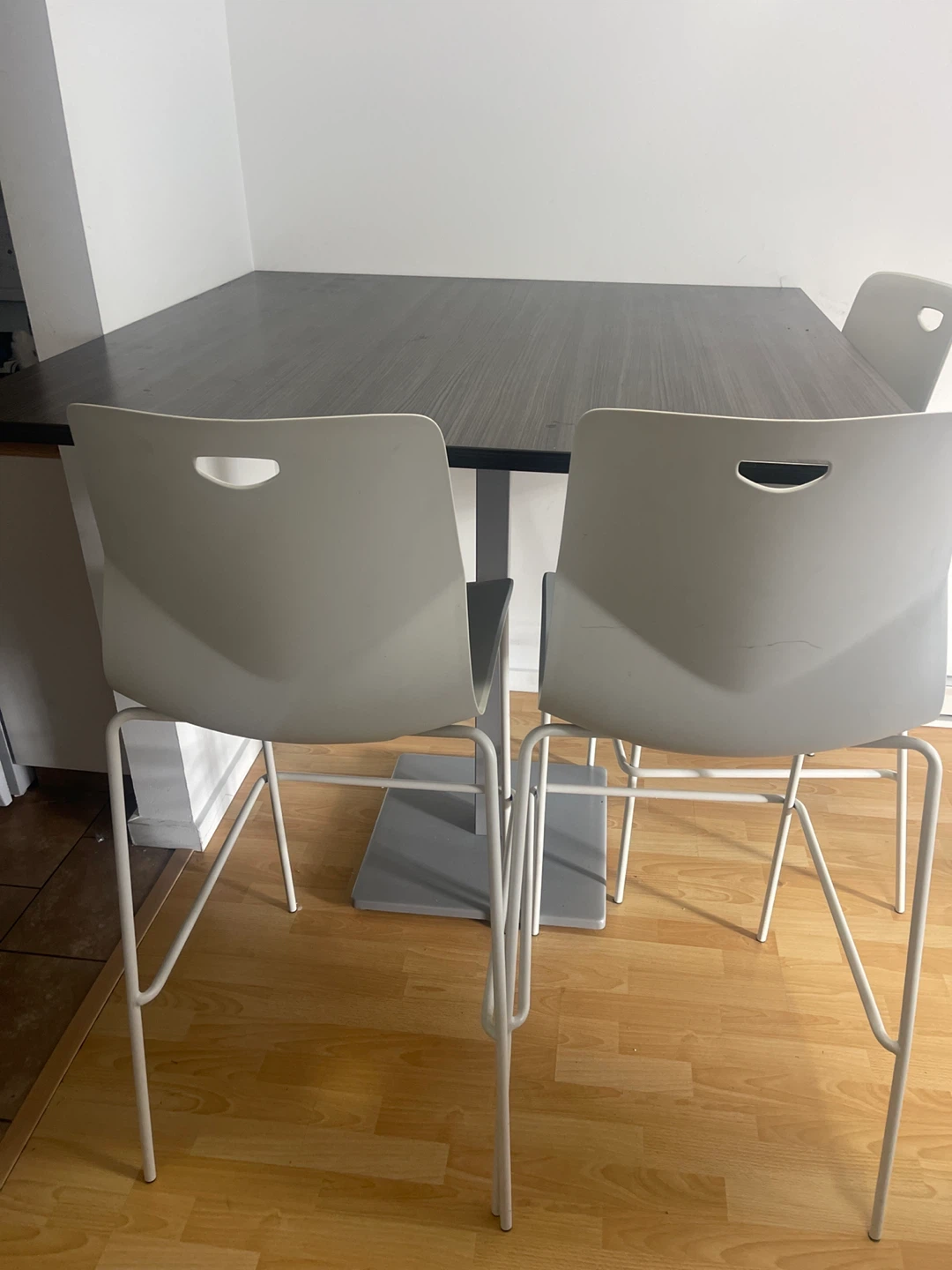 A dinner table with four chairs - photo 3