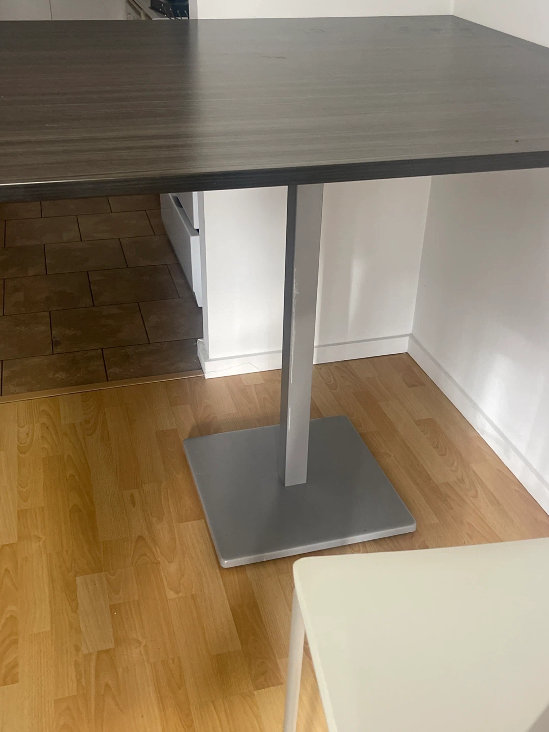 A dinner table with four chairs