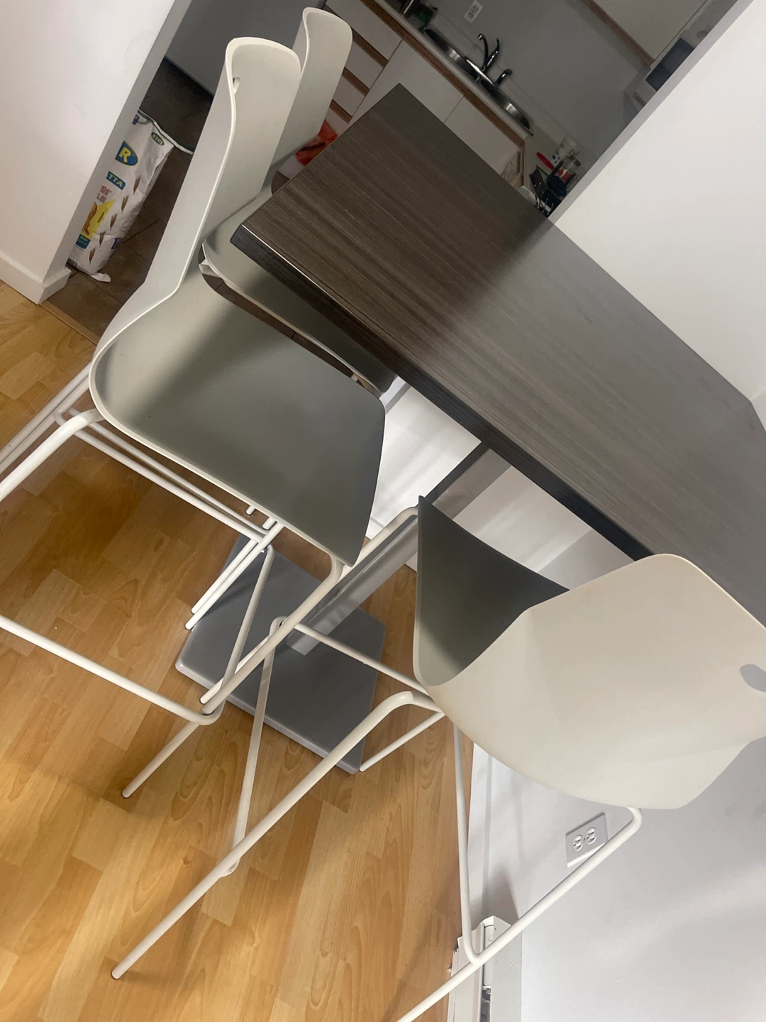 A dinner table with four chairs - photo 4