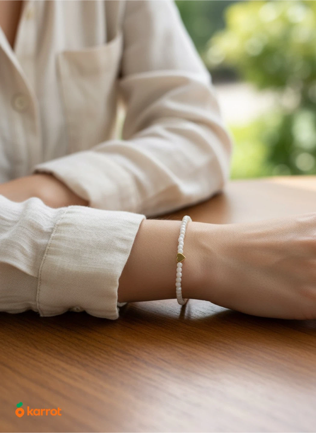 White beaded bracelet with gold heart