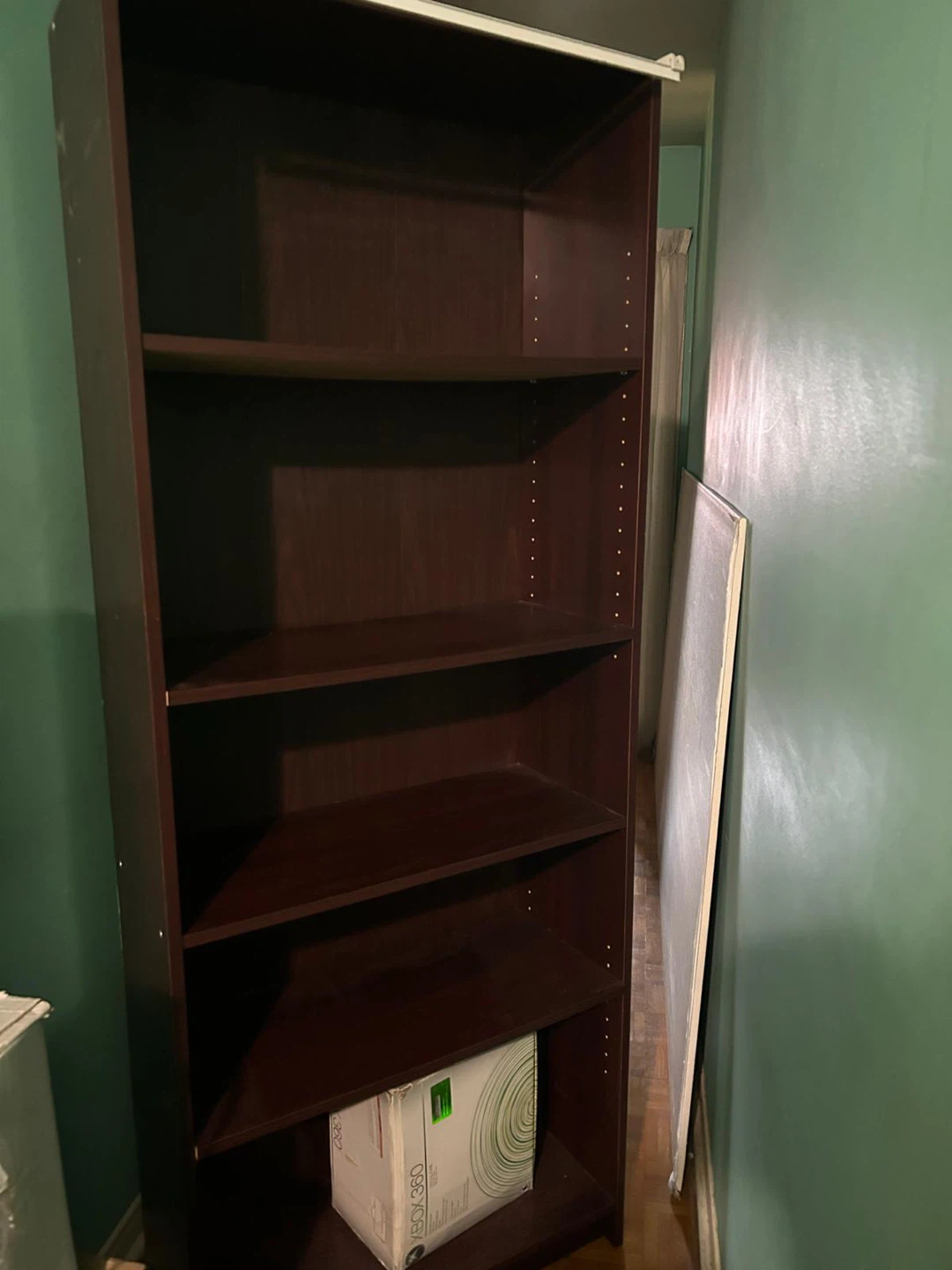 Brown Bookcase with White Curtain