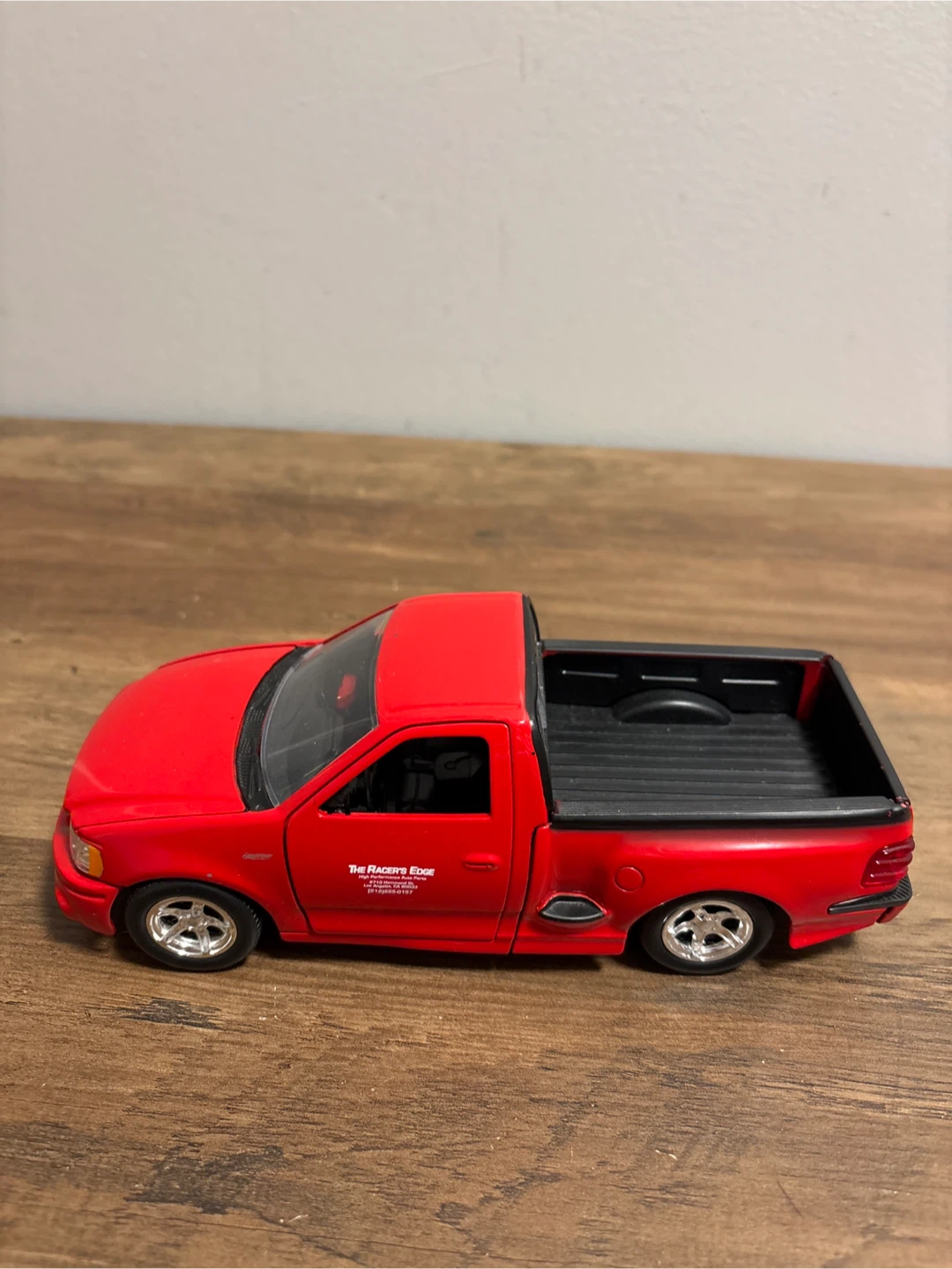 Red Ford F-150 SVT Lightning Diecast Model - photo 2