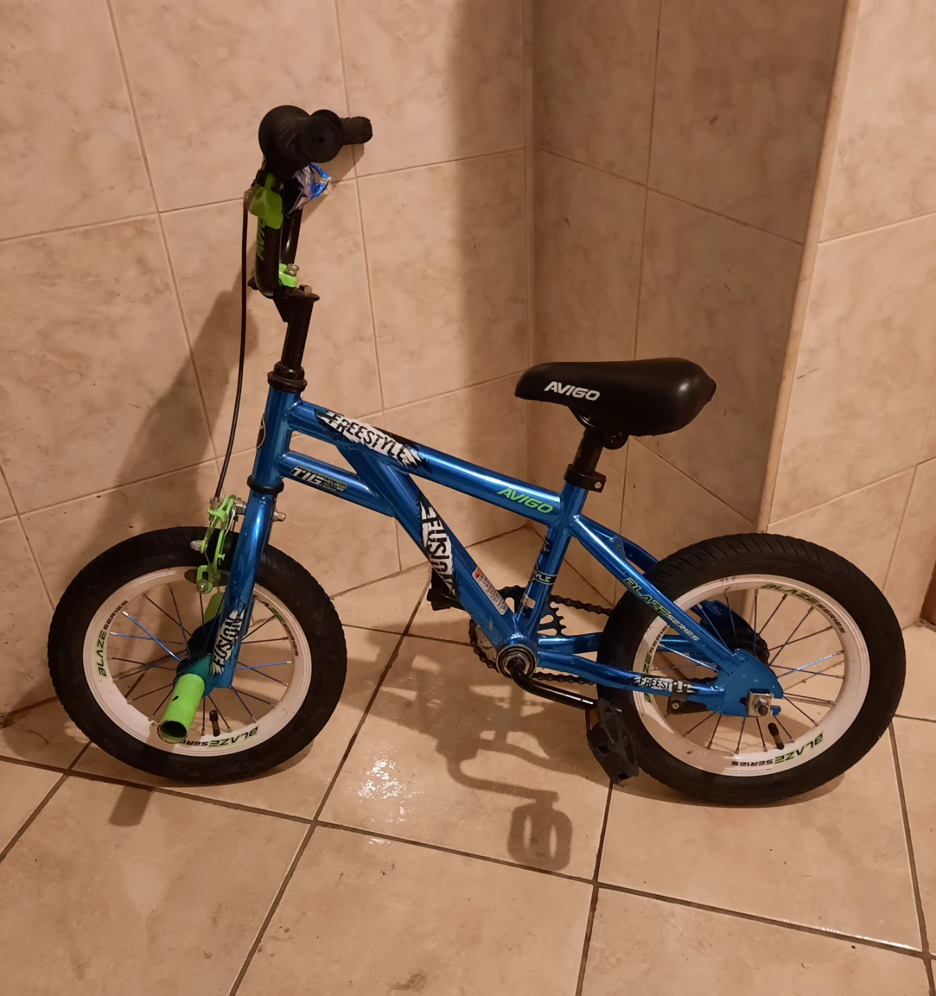 14" small kids bike with training wheels included.