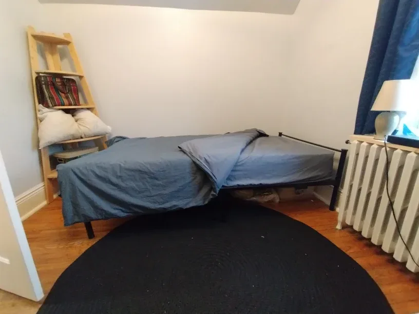 Black Metal Bed Frame with mattress and sheets image indicator(2)