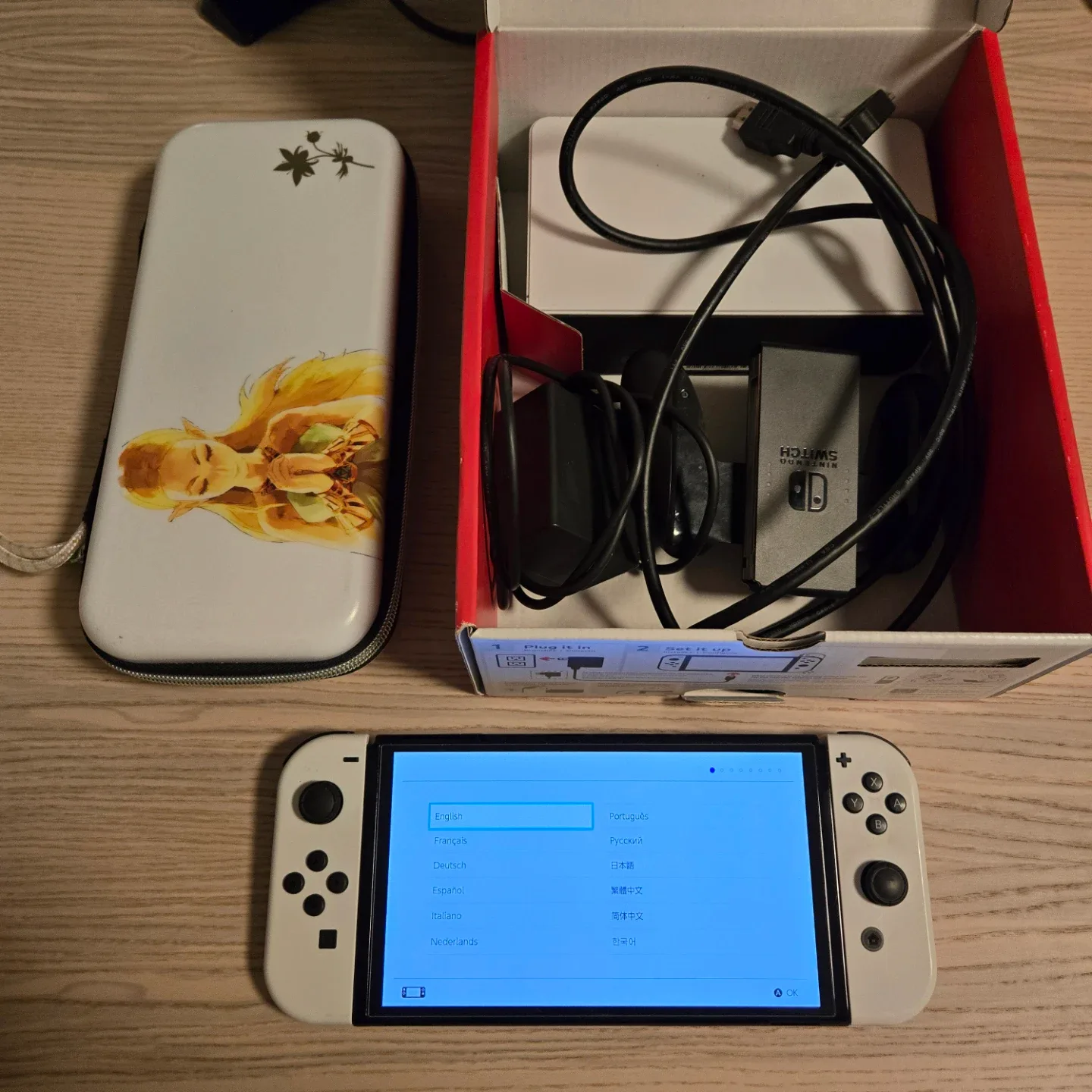 Nintendo Switch OLED like new in box. With extras