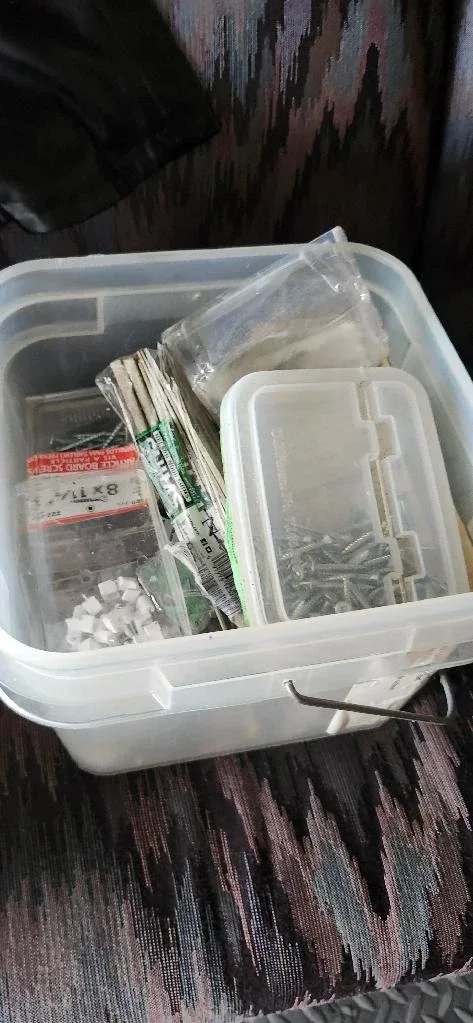 different containers of pining and screws