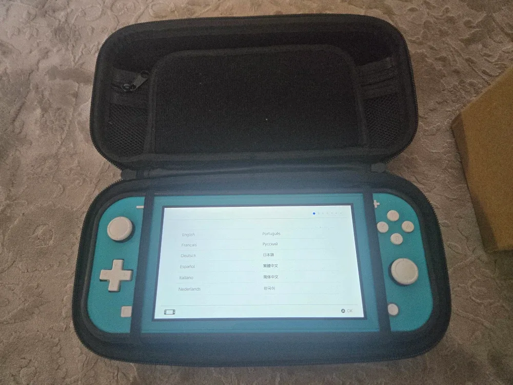 Nintendo Switch Lite Turquoise with Case & Charger