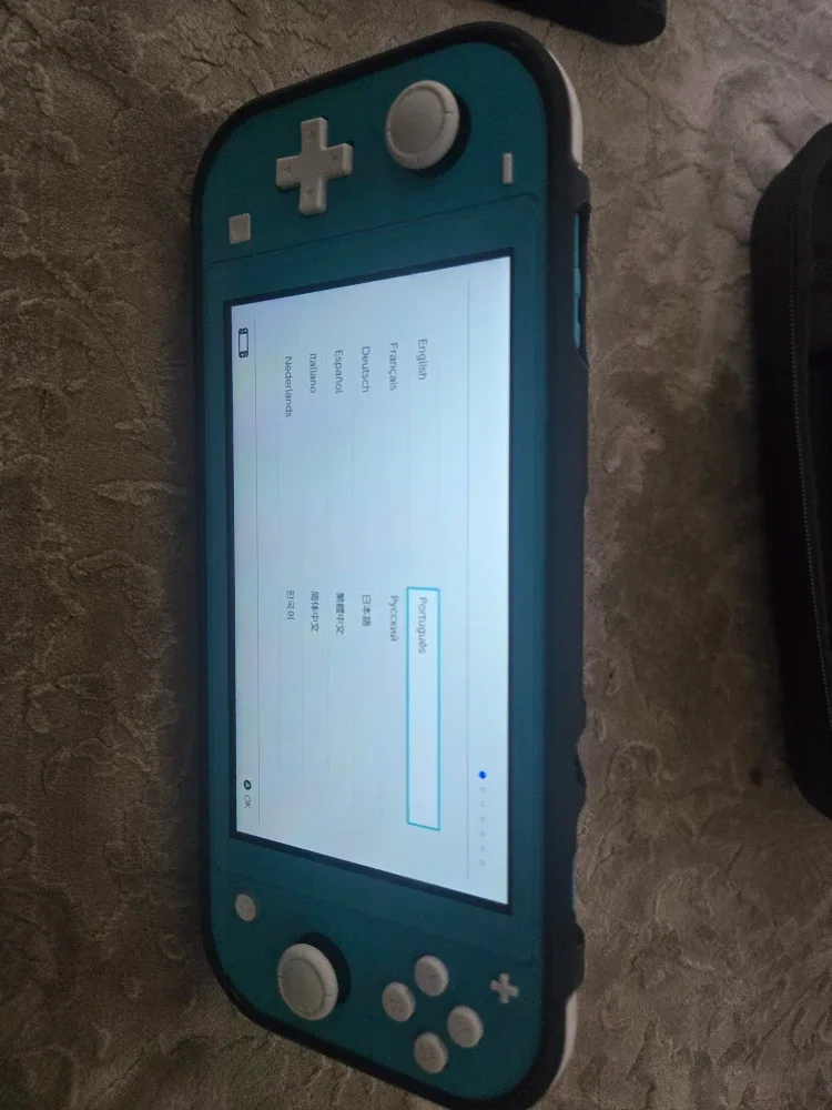 Nintendo Switch Lite Turquoise with Case & Charger image indicator(3)