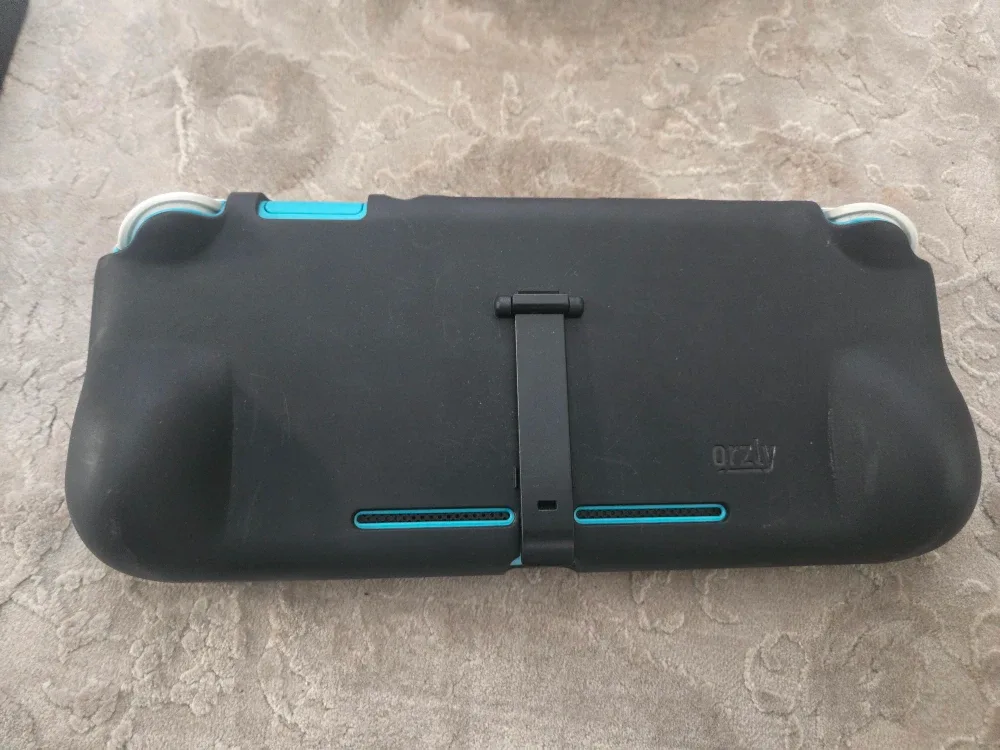 Nintendo Switch Lite Turquoise with Case & Charger image indicator(6)