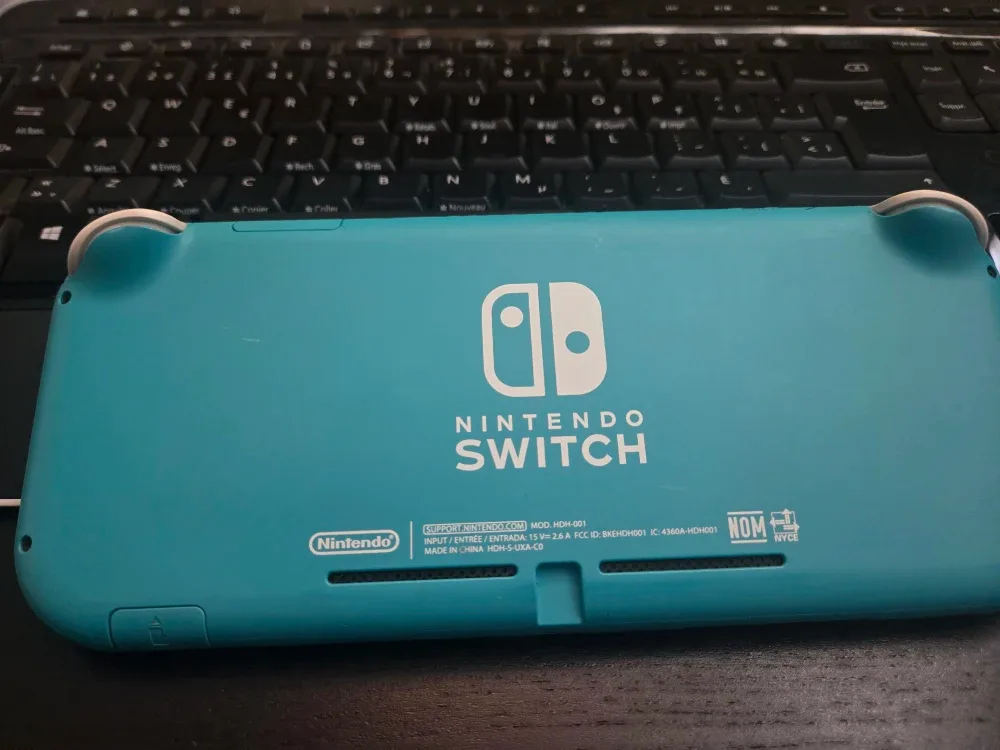 Nintendo Switch Lite Turquoise with Case & Charger image indicator(8)