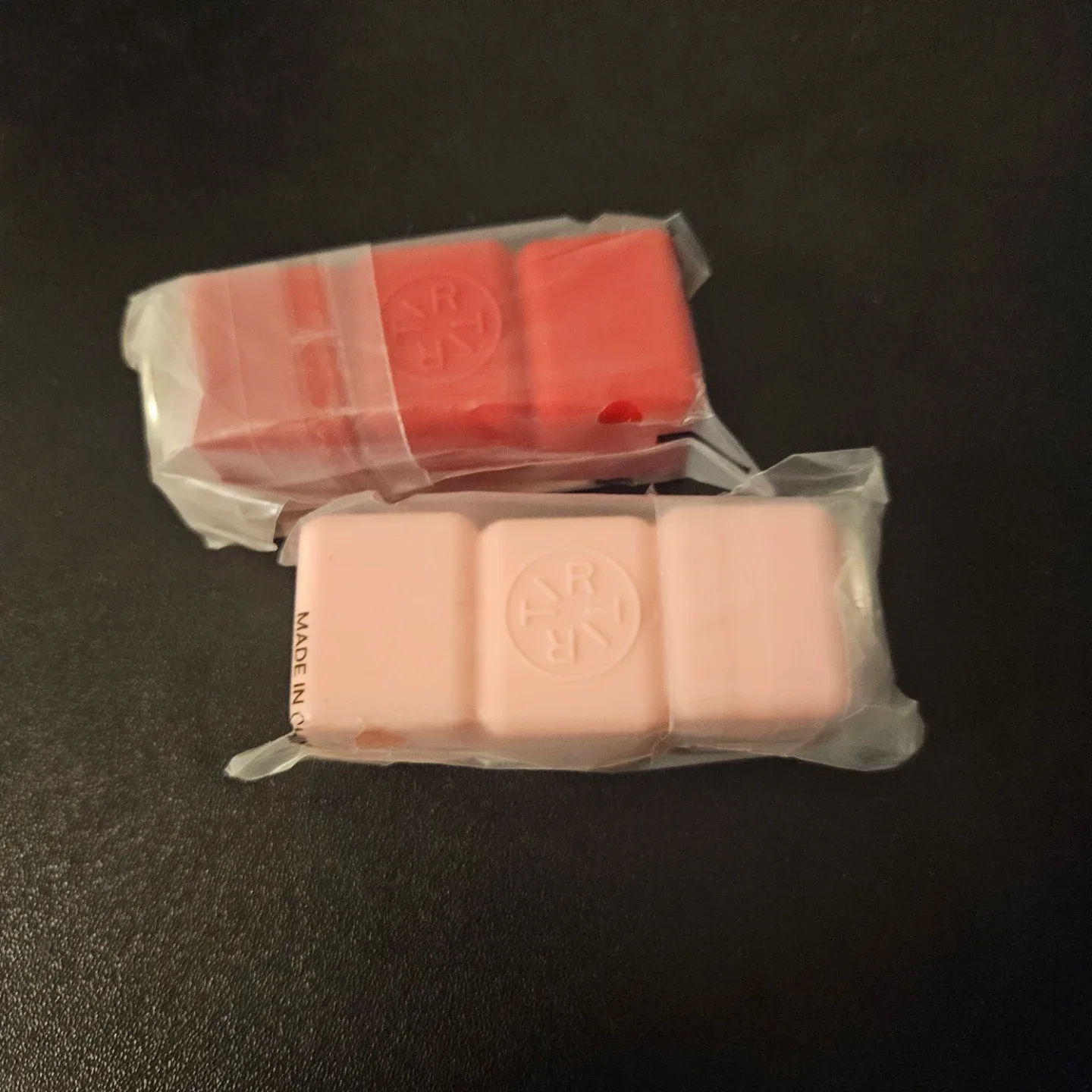 Tirtir mini lip tint keychain in red and pink