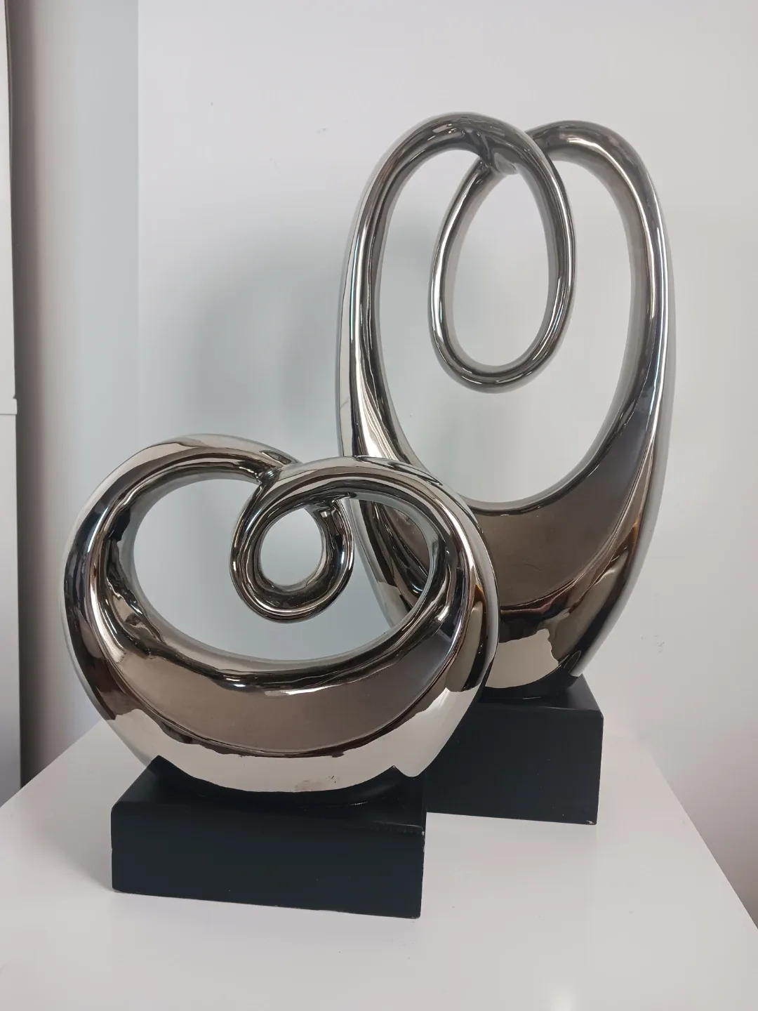 Entwined Elegance: Chrome Abstract Sculpture Set