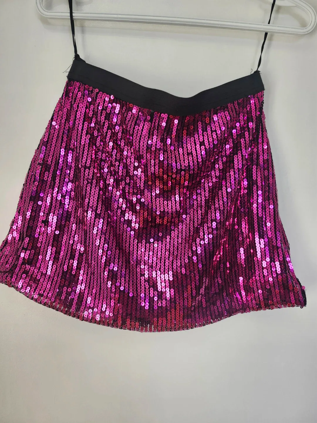 Green Polo Shirt & Pink Sequin Skate. Skirt