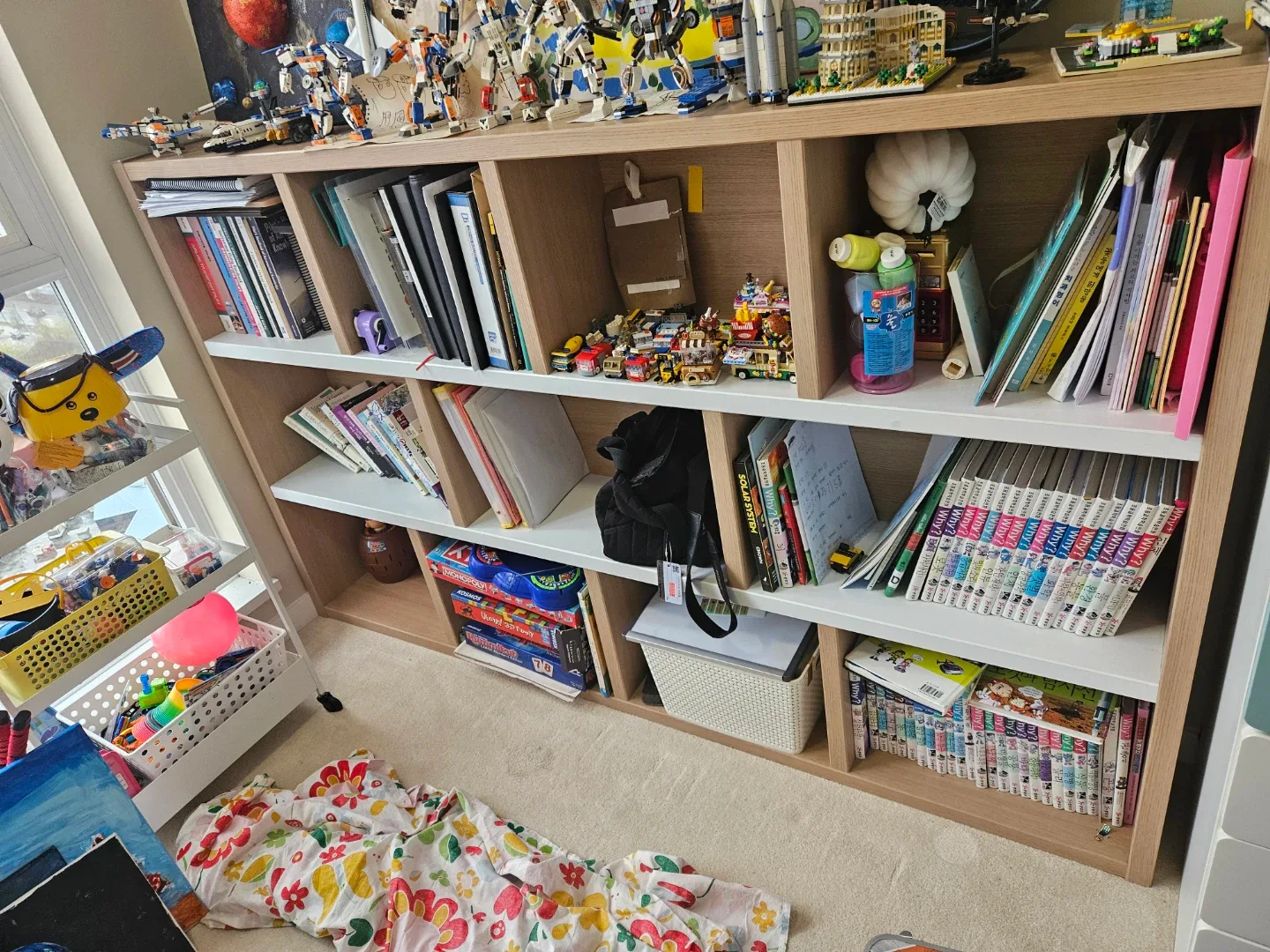 Bookshelf with Various Books and Items