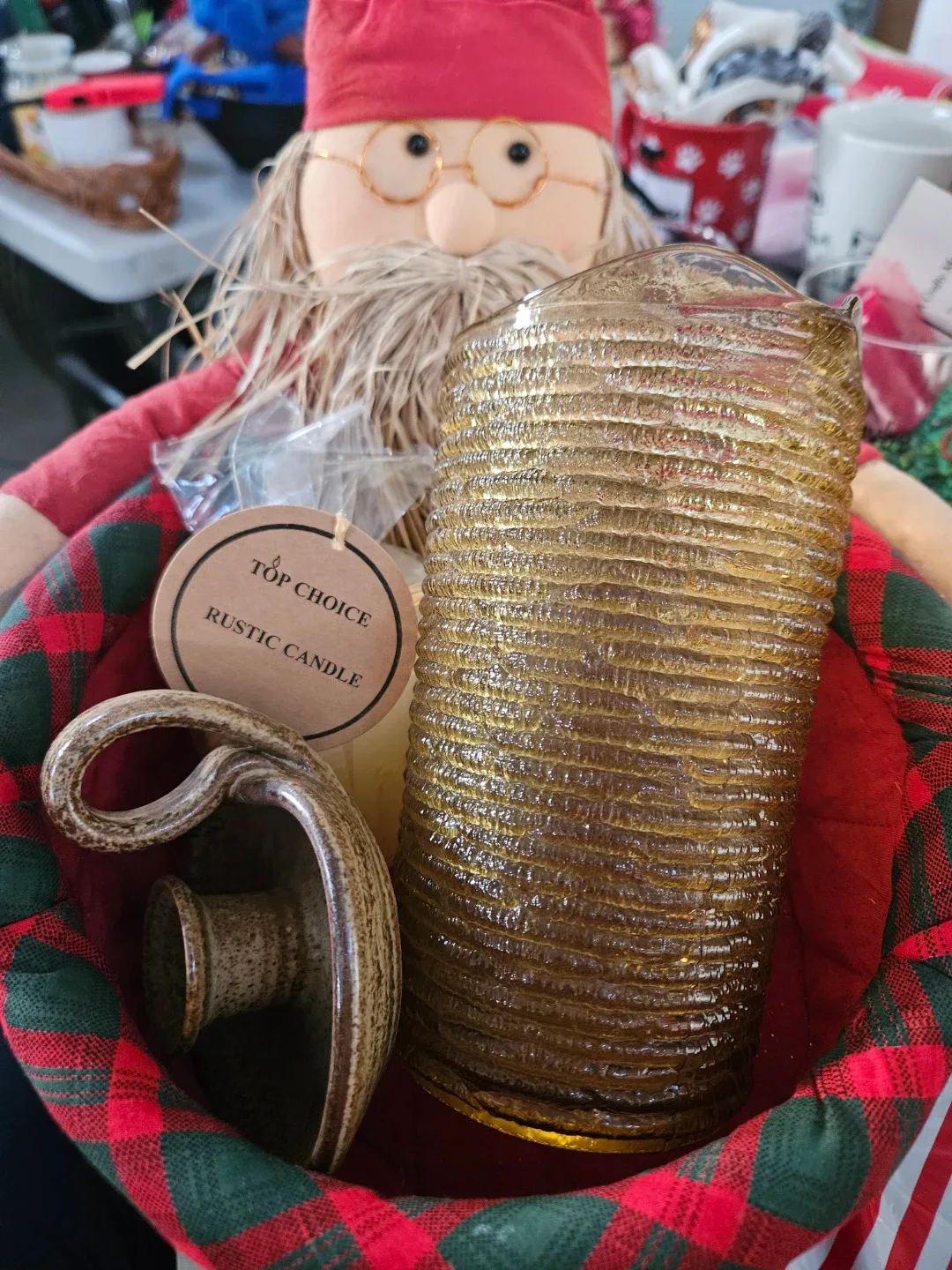 Basket filled with vintage jug, candle gilder, candle