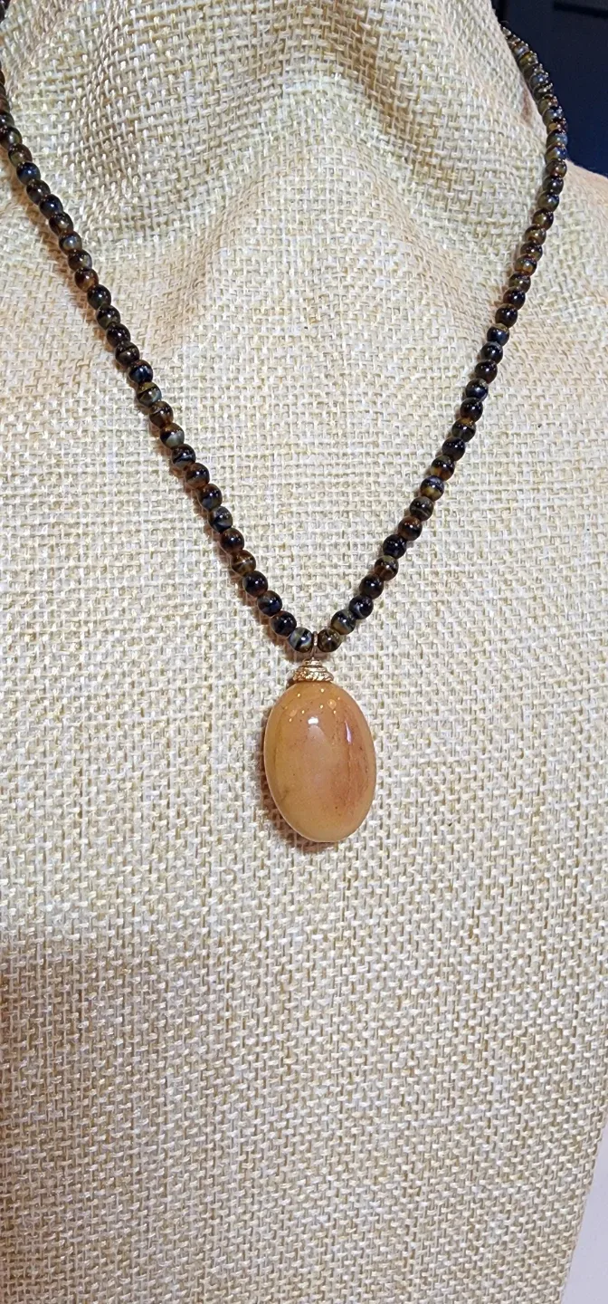 Elegant Beaded Necklace with Amber-Tone Pendant image indicator(3)