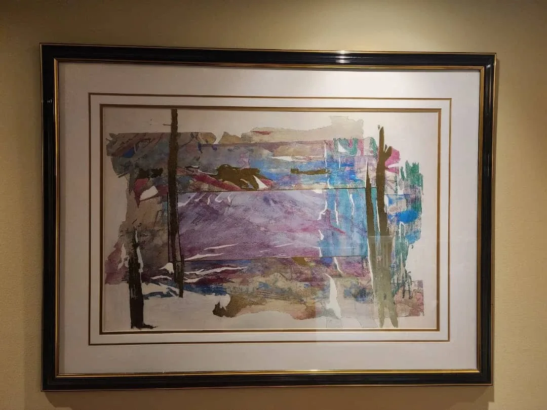 An abstract mixed-media artwork housed