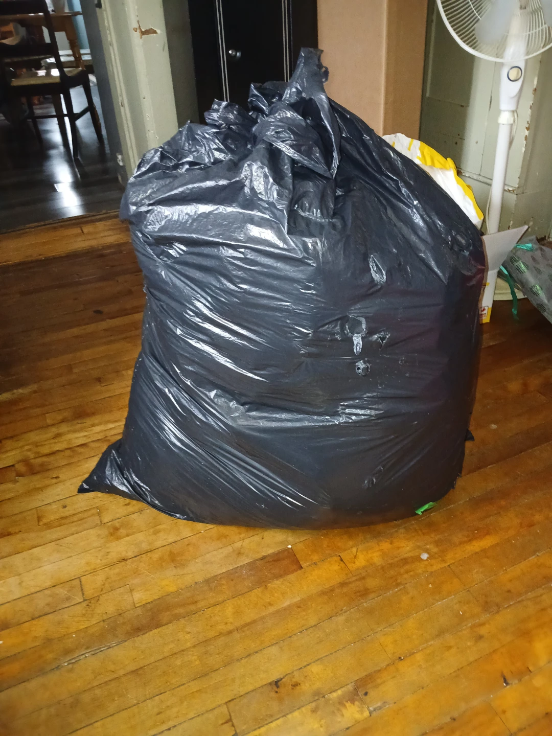 Industrial Sized Garbage Bag Full of women's clothing.