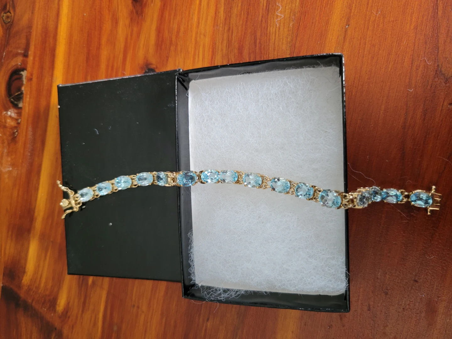 Gold Bracelet with Blue Topaz Stones