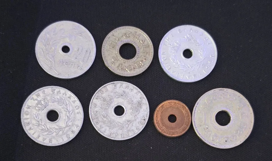 Set of 7 hole coins from the world