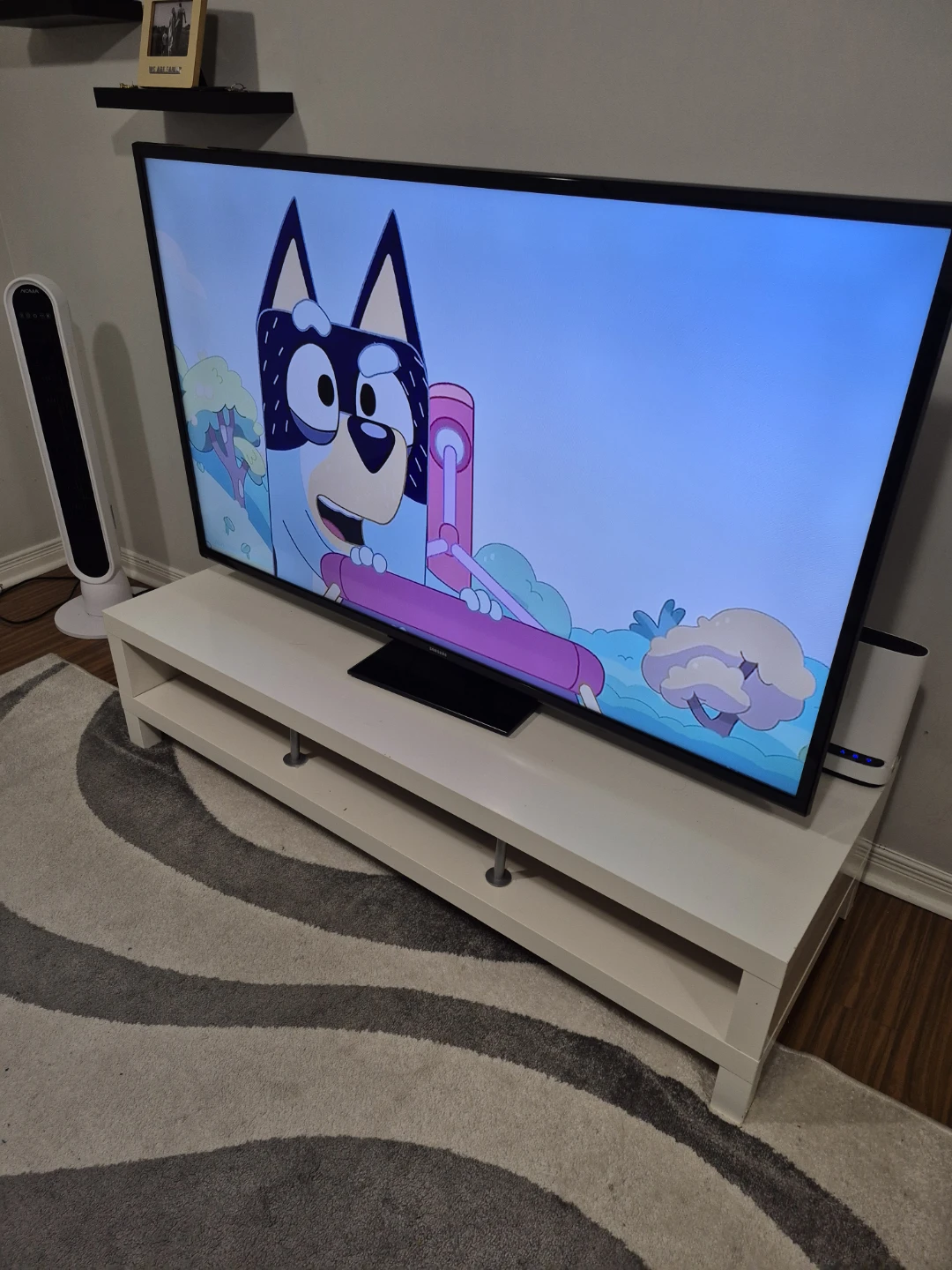 Samsung TV on White TV Stand