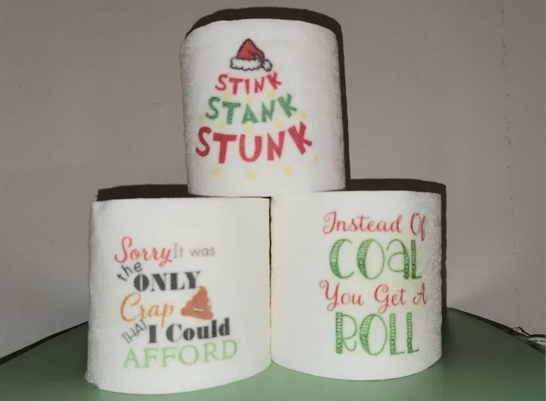 Gag gift rolls of Christmas toilet paper