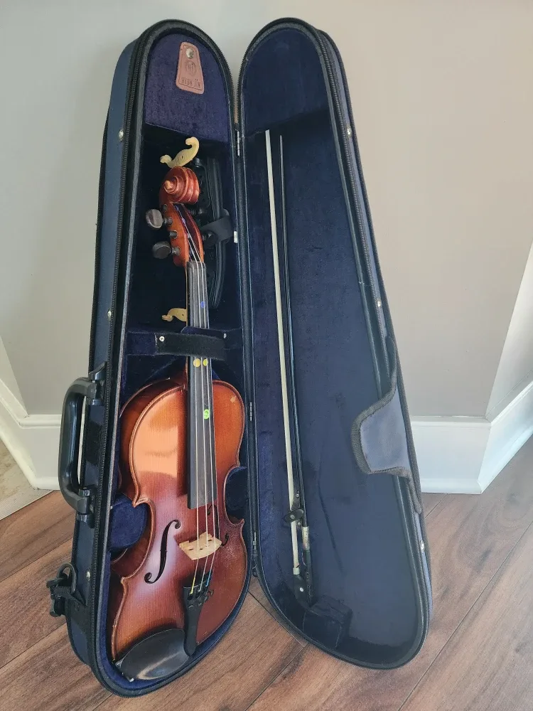 1/2 size violin with case, bow, and Kun shoulder rest