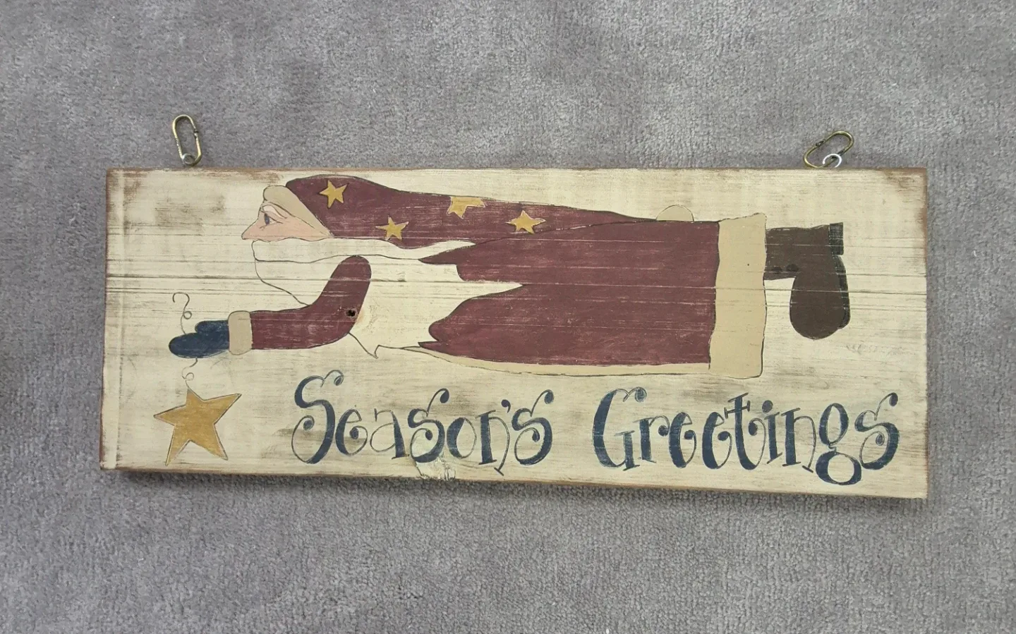 Primitive wooden flying santa sign