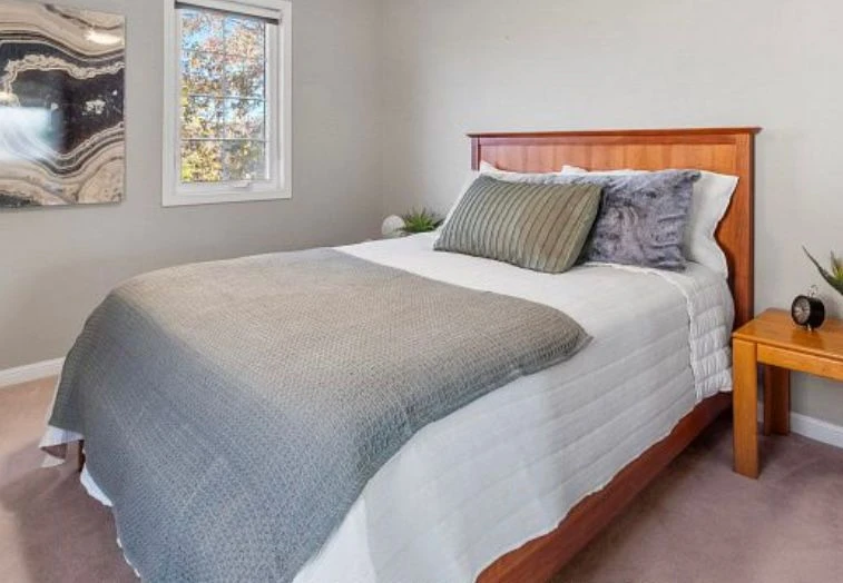 Queen size headboard, footboard, side rails, and mattress.