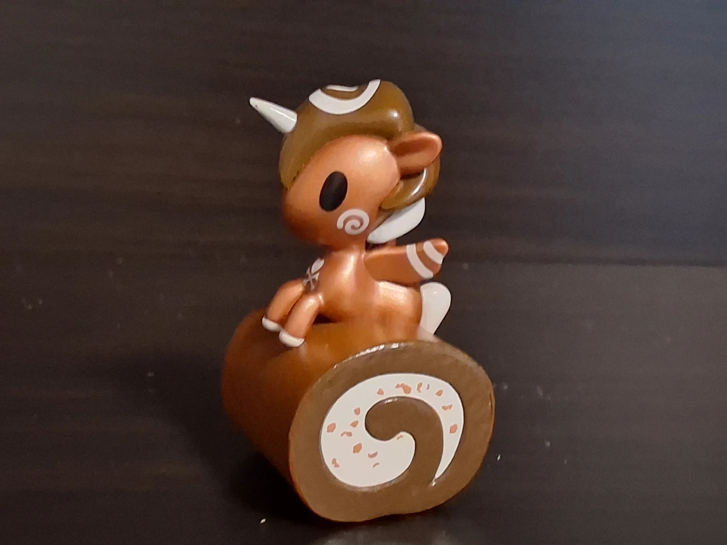 Tokidoki Unicorno figurine on a Swiss roll