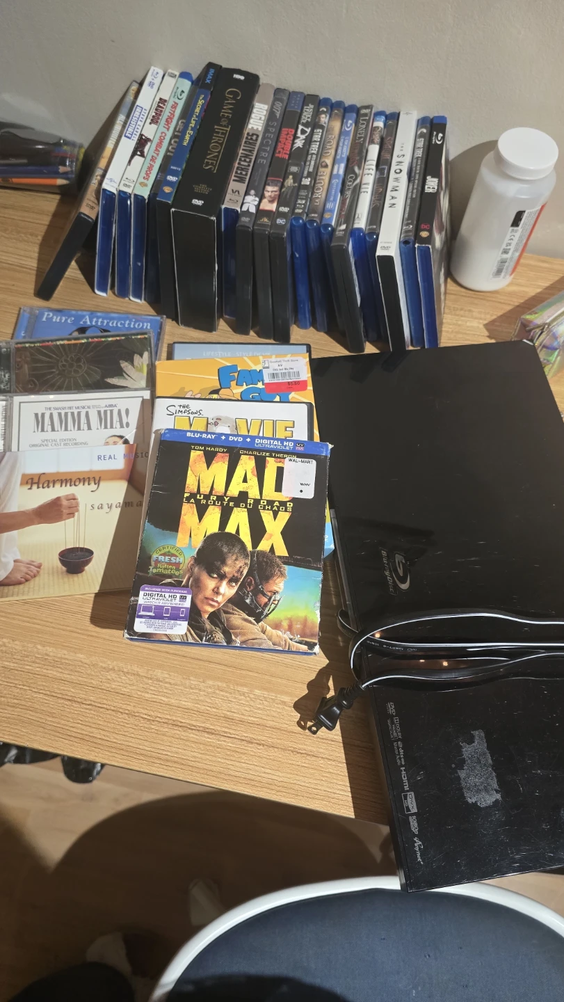 CD player. Collection of Blu-ray, DVD, and CD Movies & Music