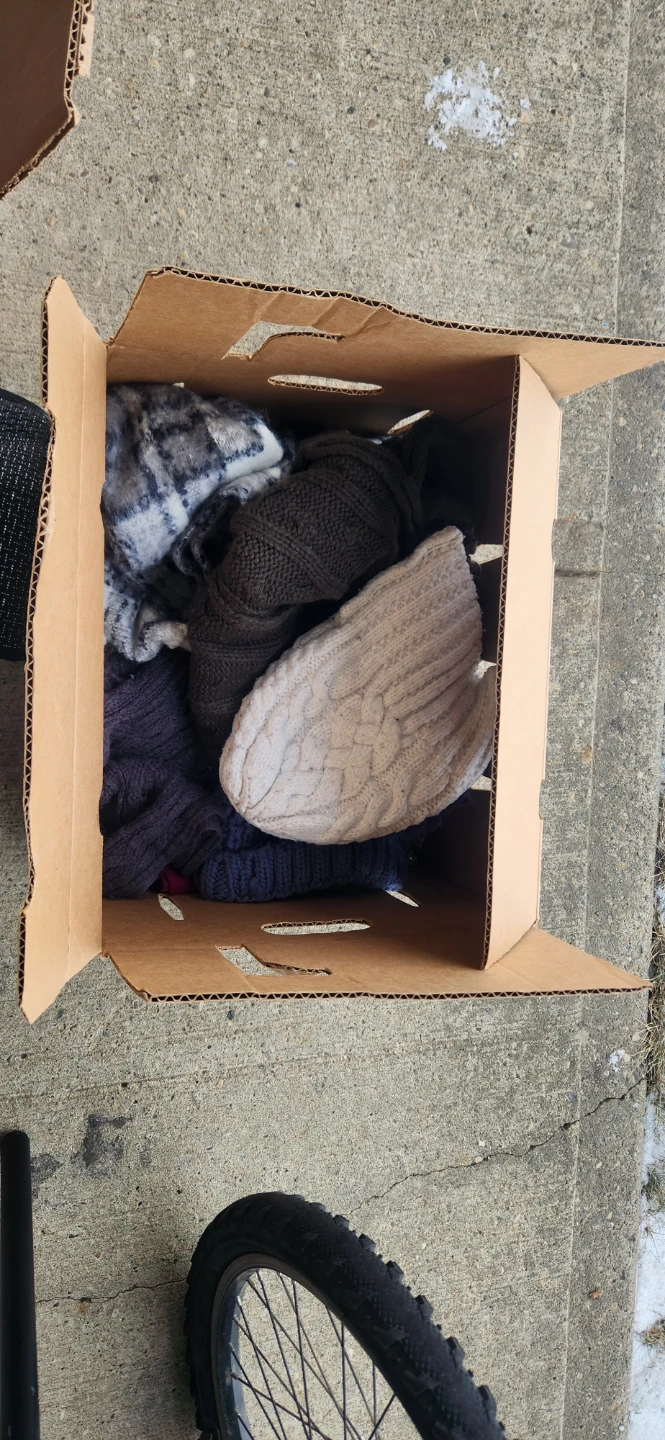 Box of assorted clothing and shoes