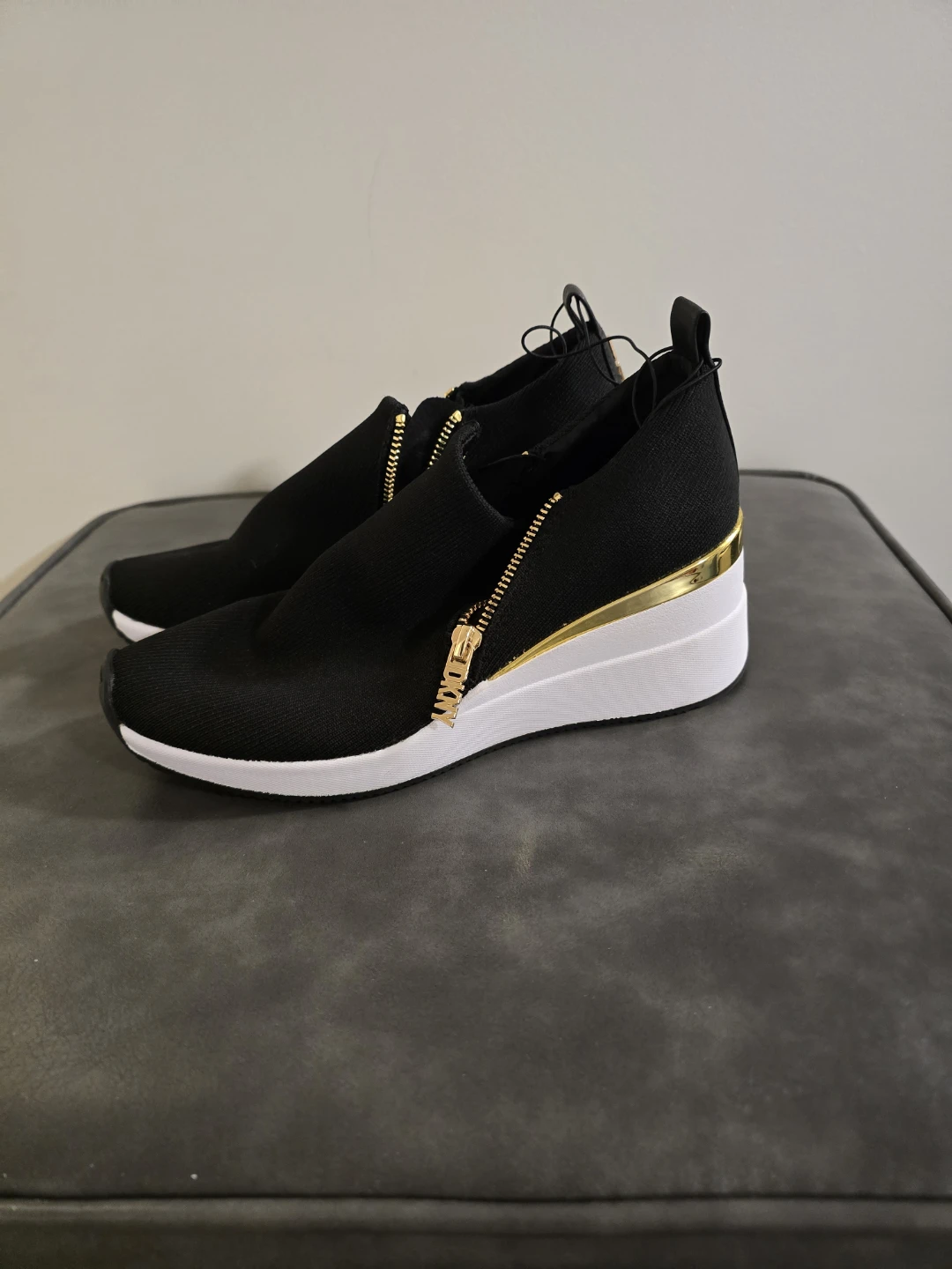 DKNY Black Wedge Sneakers with Gold Zipper Accent