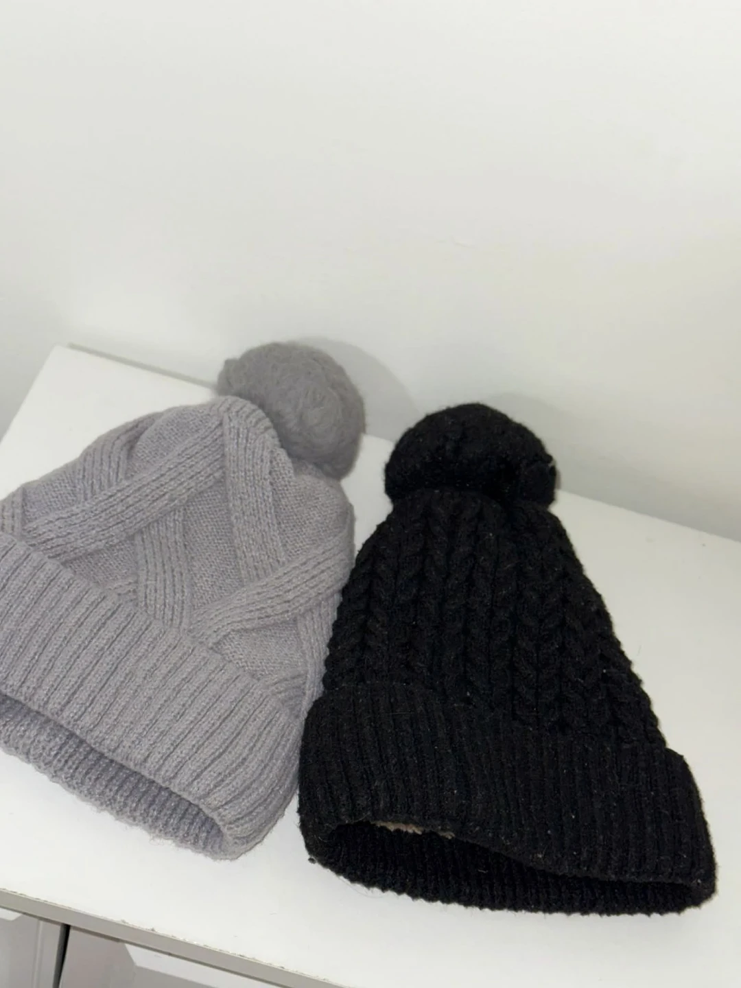 Black earmuffs and knit hats - photo 3