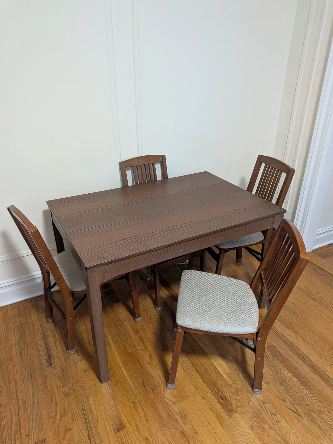 Dining table with four foldable chairs